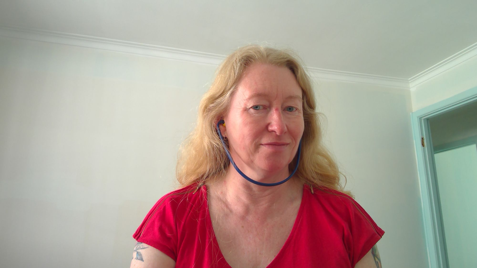 Photo of Donna wearing safety earplugs